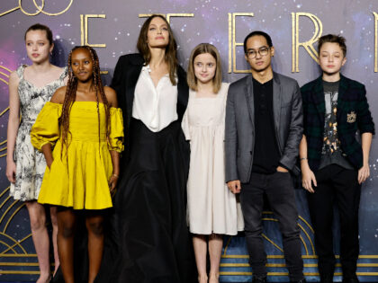 US actor Angelina Jolie (3rd L) poses with her children, (L-R) Shiloh Jolie-Pitt, Zahara Jolie-Pitt, Vivienne Jolie-Pitt, Maddox Jolie-Pitt and Knox Jolie-Pitton on the red carpet on arrival to attend the UK Gala Screening of the film 'Eternals', at the BFI IMAX in London on October 27, 2021. (Photo by …