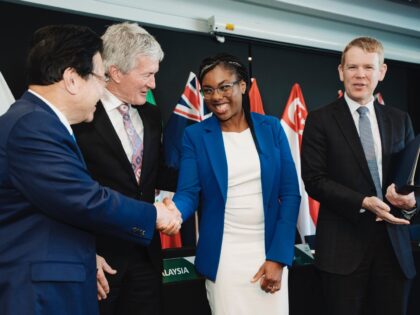 Kemi Badenoch, British Trade Minister, second right, shakes hands with Japan's Minister of Economic & Fiscal Policy Shigeyuki Goto, left, as New Zealand Minister for Trade and Export Growth Damien O'Connor, and New Zealand Prime Minister Chris Hipkins, right, watch during the Trans-Pacific Partnership (TPP) Ministerial Meeting in Auckland, New …