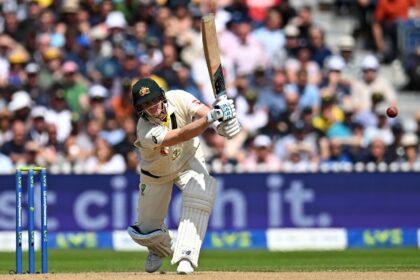 On the attack: Australia's Steve Smith hits out against England in the fourth Test at Old Trafford