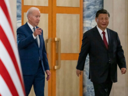 U.S. President Joe Biden, left, arrives with Chinese President Xi Jinping for a meeting on the sidelines of the G20 summit meeting, Monday, Nov. 14, 2022, in Bali, Indonesia. (AP Photo/Alex Brandon)