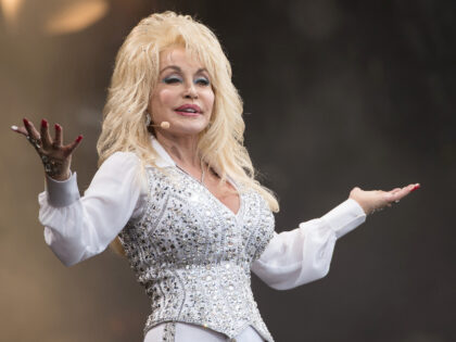 GLASTONBURY, ENGLAND - JUNE 29: Dolly Parton performs on the Pyramid Stage during Day 3 of the Glastonbury Festival at Worthy Farm on June 29, 2014 in Glastonbury, England. (Photo by Ian Gavan/Getty Images)