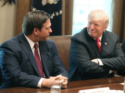 WASHINGTON, DC - DECEMBER 13: Florida Governor-elect Ron DeSantis (R) sits next to U.S. President Donald Trump during a meeting with Governors elects in the Cabinet Room at the White House on December 13, 2018 in Washington, DC.