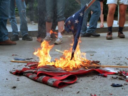 (FILES): This 20 April 2002 file photo shows demonstrators burning US flags in front of the World Bank headquarters during a protest against the International Monetary Fund - World Bank spring meetings in Washington, DC. The US Senate began debate 26 June 2006 on a constitutional amendment banning destruction and …