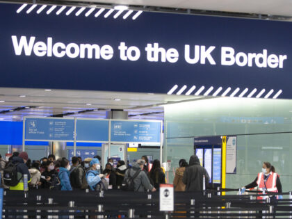 Passengers line up for passport control in the UK Border area of Terminal 2 of Heathrow Airport, London, during a visit from Labour leader Sir Keir Starmer to see the COVID-19 response. Picture date: Thursday February 11, 2020. See PA story POLITICS Labour. (Photo by Ian Vogler/Daily Mirror/PA Images via …