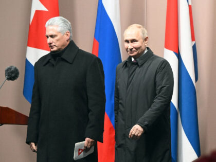Cuban President Miguel Diaz-Canel Bermudez (L) and Russian President Vladimir Putin (R) leave after the inauguration of a monument to late Cuban leader Fidel Castro in Moscow on November 22, 2022. (Photo by Sergei GUNEYEV / SPUTNIK / AFP) (Photo by SERGEI GUNEYEV/SPUTNIK/AFP via Getty Images)