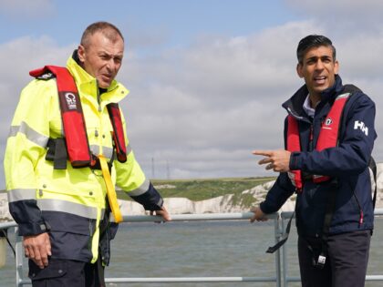 DOVER, ENGLAND - JUNE 05: Prime Minister Rishi Sunak with director of Small Boats Operational Command (SBOC) Duncan Capps (left), onboard Border Agency cutter HMC Seeker during a visit to Dover, ahead of a press conference to update the nation on the progress made in the six months since he …