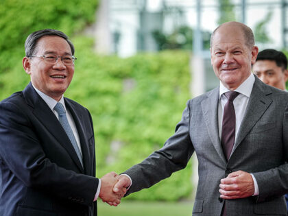German Chancellor Olaf Scholz (R) greets Chinese Premier Li Qiang upon the arrival of the Chinese government delegation at the Chancellery on June 19, 2023 in Berlin, Germany. Germany and China are holding government consultations in Berlin that will officially begin tomorrow. (Photo by Sean Gallup/Getty Images)