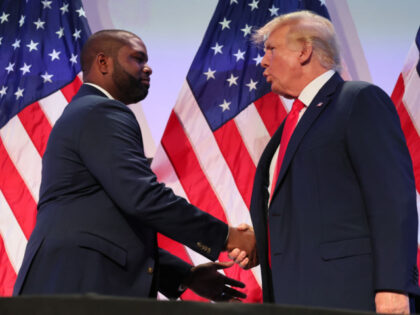 PHILADELPHIA, PENNSYLVANIA - JUNE 30: Rep. Byron Donalds (R-FL) shakes hands with former U.S. President Donald Trump during the Moms for Liberty Joyful Warriors national summit at the Philadelphia Marriott Downtown on June 30, 2023 in Philadelphia, Pennsylvania. The self-labeled "parental rights" summit is bringing school board hopefuls from across …