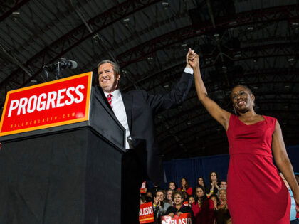 Newly elected New York City Mayor Bill de Blasio (L) holds hands with his wife Chirlane McCray at his election night party on November 5, 2013 in New York City. De Blasio beat out Republican candidate Joe Lhota and will succeed Michael Bloomberg as the 109th mayor of New York …