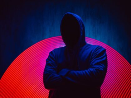 Hacker against red background