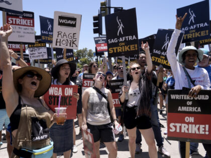 Striking writers and actors take part in a rally outside Paramount studios in Los Angeles on Friday, July 14, 2023. This marks the first day actors formally joined the picket lines, more than two months after screenwriters began striking in their bid to get better pay and working conditions. (AP …