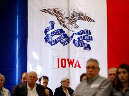 The Iowa state flag stands behind attendees as they listen to Republican presidential candidate, Sen. Marco Rubio, R-Fla., during a town hall in Sioux City, Iowa, Saturday, Jan. 30, 2016. (AP Photo/Patrick Semansky)