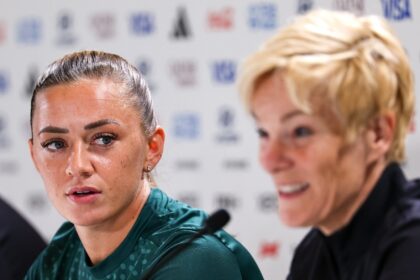 Ireland team captain Katie McCabe (L) listens as coach Vera Pauw answers a question during a press conference