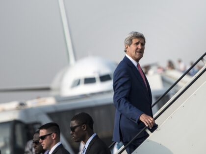 US Secretary of State John Kerry boards his plane at Cairo International Airport on September 13, 2014 as he leaves the Egyptian capital. Kerry said Egypt was on the frontline in fighting "terrorism" after meeting its leadership for support against Islamic State jihadists in Iraq and Syria. AFP PHOTO/POOL / …