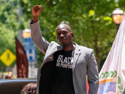 ATLANTA, GA - JUNE 18: Khalid Kamau, Mayor of South Fulton, Georgia, raises his fist while participating in the Juneteenth Atlanta Black History parade on June 18, 2022 in Atlanta, United States. (Photo by Elijah Nouvelage/Getty Images)