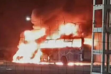 The passenger bus is seen in flames after the accident that killed more than 30 people in Algeria's southern desert, in an image grab from an online video