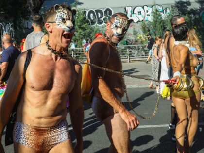 MADRID, SPAIN - 2023/07/01: A couple of masked men are pulled in chains by a woman during the march. Madrid has celebrated another year of pride festivities through the streets of the center of the Spanish capital. (Photo by David Canales/SOPA Images/LightRocket via Getty Images)