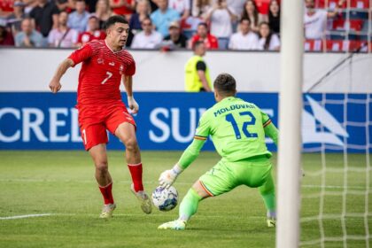 Switzerland forward Zeki Amdouni (L) has joined Burnley