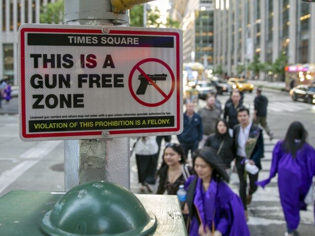 A sign informing people, "This is a Gun Free Zone," is in midtown Manhattan in New York City on Friday, May 19, 2023. The Times Square area is one of scores of "sensitive" places — including parks, churches and theaters — that are off-limits for guns under a sweeping state …