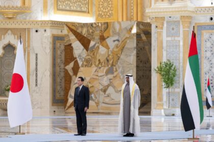 UAE President Sheikh Mohammed bin Zayed Al Nahyan (R) welcoming Japan's Prime Minister Fumio Kishida