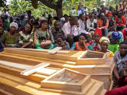 Uganda: MOurners gather for the funeral of Florence Masika and Zakayo Masereka during their burial rituals in Mpondwe on June 18, 2023. Florence and Zakayo have been killed near the border with the Democratic republic of Congo by fleeing assaliants who the authorities believe to belong to the Allied Democratic …