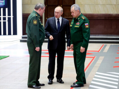 FILE - Russian President Vladimir Putin, center, speaks with Chief of the General Staff Gen. Valery Gerasimov, left, and Russian Defense Minister Sergei Shoigu, after a meeting with senior military officers in Moscow, Russia, Wednesday, Dec. 21, 2022. Russia’s rebellious mercenary chief Yevgeny Prigozhin walked free from prosecution for his …