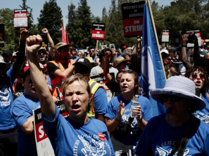 LOS ANGELES CA JUNE 21, 2023 — With the Writers Guild of America strike now in its eighth week, thousands of union members and supporters marched from Pan Pacific Park toward a planned multi-union rally near the La Brea Tar Pits Wednesday, June 21, 2023. (Irfan Khan / Los Angeles …
