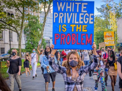 Hunter - BROOKLYN, NEW YORK, UNITED STATES - 2020/09/05: A participant holding a White Privilege Is The Problem sign at the protest. Brooklynites gathered at Cadman Plaza for a march in the streets of Brooklyn, bringing light to Black Women affected by police violence and to amplify the movement against …