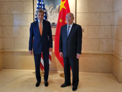 John Kerry, US special presidential envoy for climate, left, greets Xie Zhenhua, China's special envoy for climate change, ahead of talks in Beijing, China, on Monday, July 17, 2023. Kerry opened the first major climate talks with Chinese officials in almost a year, as both sides pledged to work for …