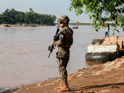 A naval police officer patrols the banks of the Suchiate river in Ciudad Hidalgo, Chiapas State, Mexico, to prevent illegal crossings across the border river to and from Tecun Uman in Guatemala, on June 17, 2019. (Photo by QUETZALLI BLANCO / AFP) (Photo credit should read QUETZALLI BLANCO/AFP/Getty Images)