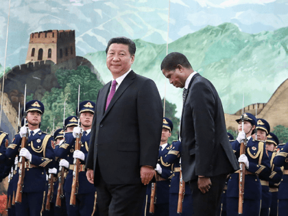 Chinese President Xi Jinping (Left) meets Zambia's President Edgar Chagwa Lungu (Right) at the Great Hall of the People on March 30, 2015 in Beijing, China. (Photo by Feng Li/Getty Images)